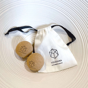 YOGASANA Cork Massage Balls Set of Two with cotton pouch, eco-friendly muscle release tools in natural light setting