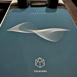 Close-up view of IMPETUS 2mm Pilates Reformer Mat - Navy Blue Edition with YOGASANA logo and wave pattern