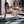 Yoga practitioner performing side stretch pose on Misty London Urban Sketch yoga mat indoors.