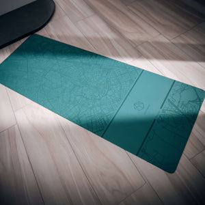 Close-up angled view of YOGASANA Renaissance Milan yoga mat texture and embossed city map detail.