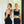 Back view of model wearing YOGASANA Cassie Cross-Back Performance Sports Bra in Midnight New York black beside another model, highlighting elegant cross-back strap design and seamless lines.