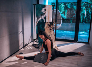 Yogasana Island Garden double-sided yoga towel used indoors, showing natural stretch and anti-slip surface.