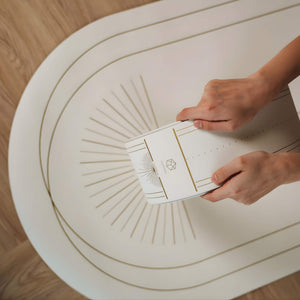 Close-up of Lumiere Sundial Yoga Wheel – White (Golden Pattern Edition) featuring the YOGASANA logo and detailed golden alignment lines.