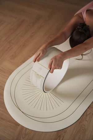 Close-up of Lumiere Sundial Yoga Wheel – White (Golden Pattern Edition) featuring the YOGASANA logo and detailed golden alignment lines.