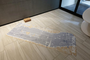 YOGASANA Urban Portrait 1mm Soft-touch Yoga Mat – Midnight New York edition laid flat in modern studio, highlighting artistic map-inspired details and ultra-thin structure.