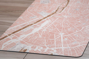 Detail shot of Yogasana Urban Portrait Daylight Paris yoga mat highlighting gold-accented Seine River and soft pink texture.