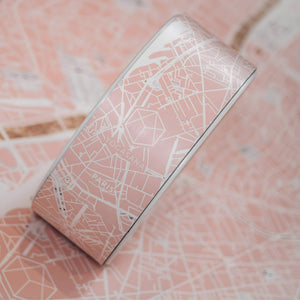 Close-up of Yogasana Daylight Paris yoga wheel showcasing intricate map of Paris in blush tones.