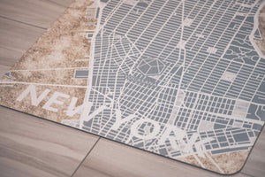 Detail shot of Yogasana Midnight New York yoga mat featuring fine map lines and marble-inspired textures.