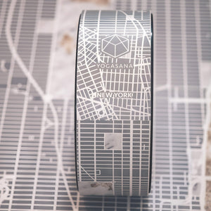 Detail view of Yogasana Urban Portrait Midnight New York yoga wheel showcasing elegant Manhattan grid pattern.