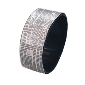 Front view of Yogasana Urban Portrait Yoga Wheel in Midnight New York design featuring monochrome city map pattern.