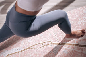 Close-up of YOGASANA 1mm travel yoga mat with urban map design, offering lightweight grip and elegant texture for mindful movement