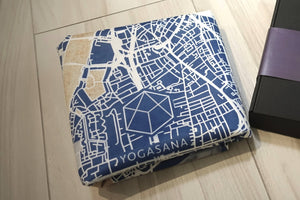 Folded Yogasana Urban Portrait 1mm Soft-touch Yoga Mat in Misty London design with city map print and logo.