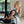 Woman leaning on Yogasana Urban Portrait Yoga Wheel in Midnight New York design for backbend stretch.